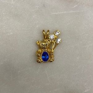 Gold toned teddy bear charm